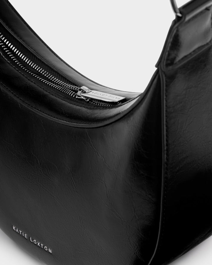 Amina patent cracke sling bag in Black