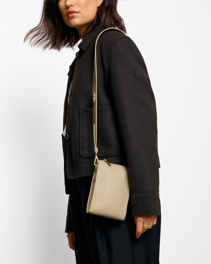 Avery slim cross body bag in Taupe