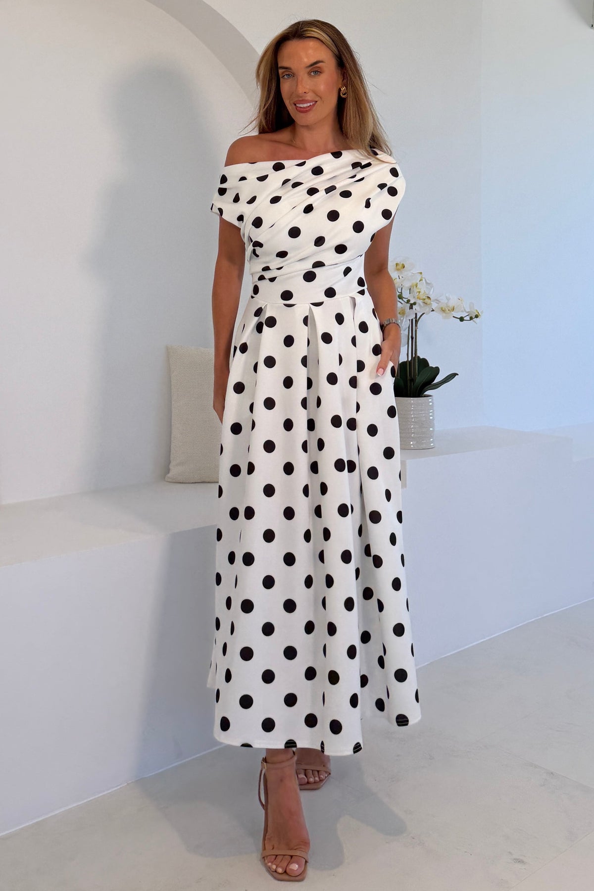 Betty Asymmetric dress in Black and white polko Dot
